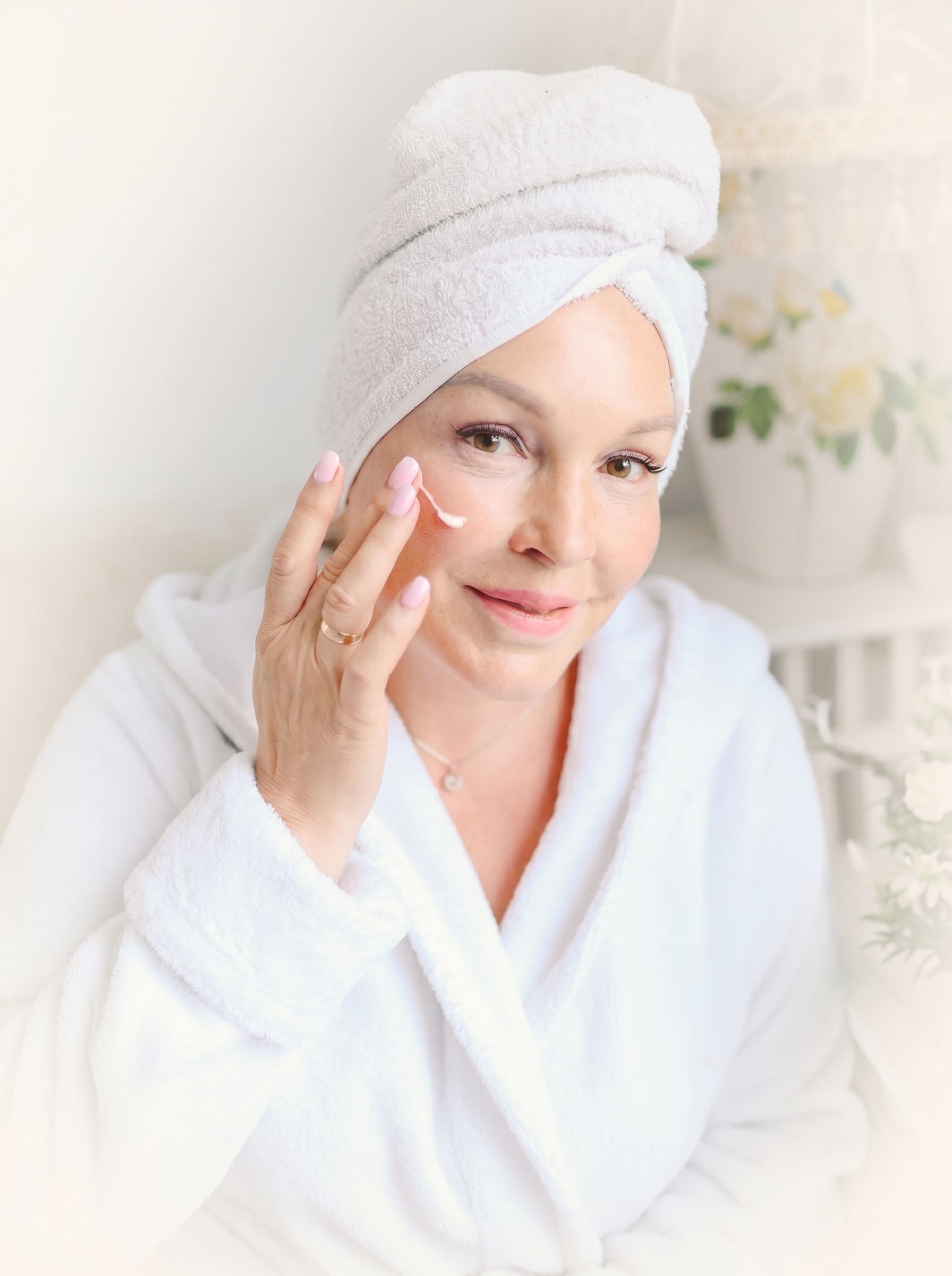 Skin care expert applying face cream